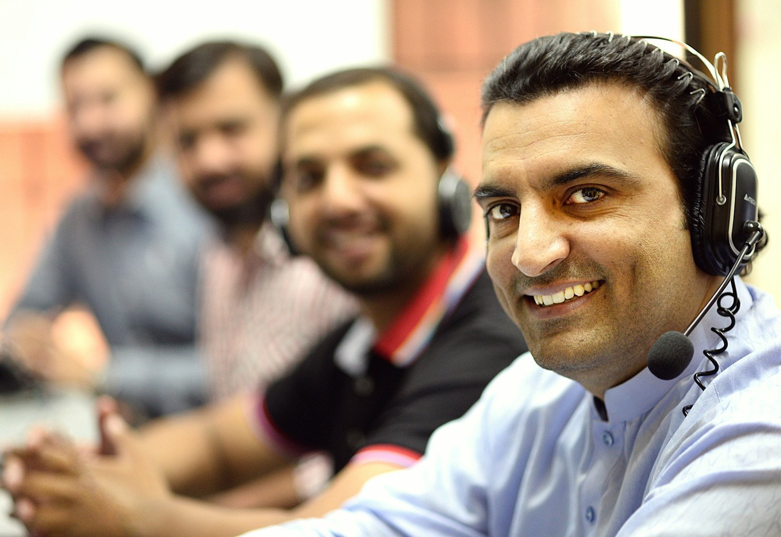 Contact centre agents handling customer conversations